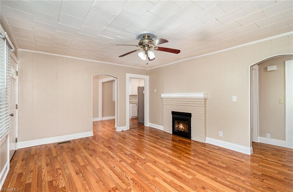 208 Rockspring Drive Thomasville, NC 27360 - Photo 7 of 28 Fireplace has electric logs that can operate with or without heat that convey.