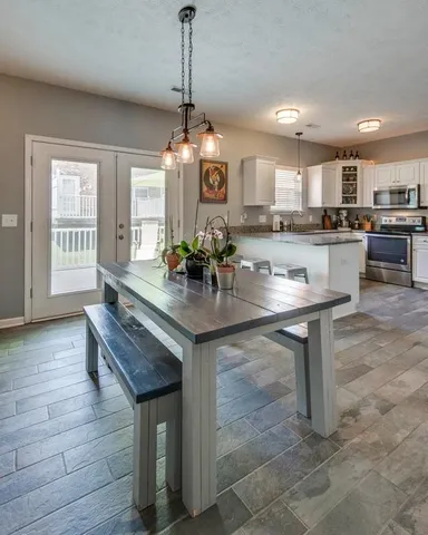 a kitchen with a counter space cabinets and appliances