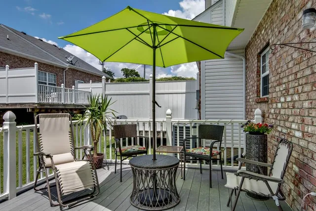 a view of a chair and table in the patio