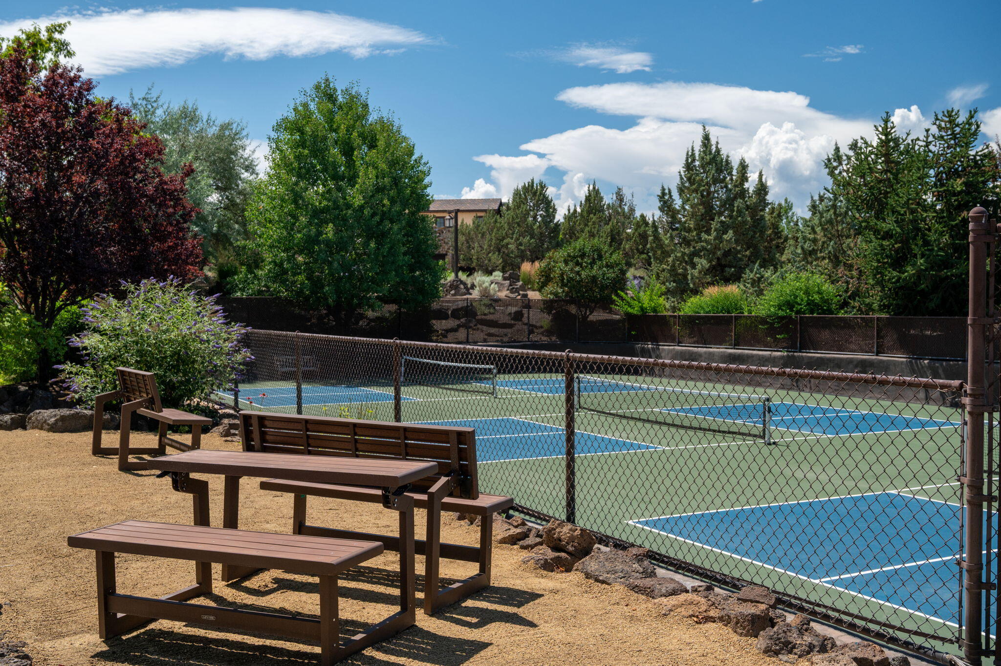 22936 Ghost Tree Lane Bend, OR 97701 - Photo 69 of 74 a view of a tennis ground with large trees