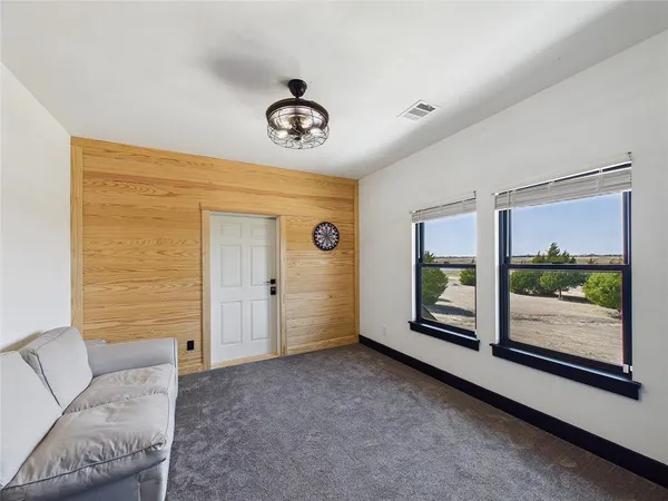 a view of livingroom with furniture and windows