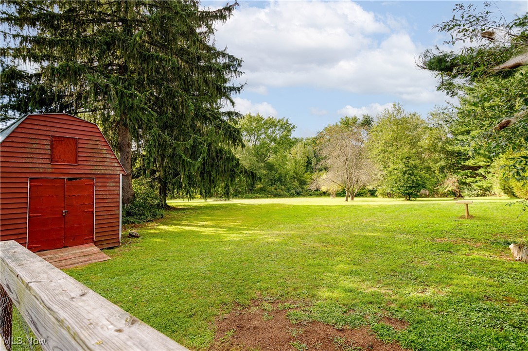 1153 Krumroy Road Akron, OH 44306 - Photo 7 of 26 View of yard featuring a shed