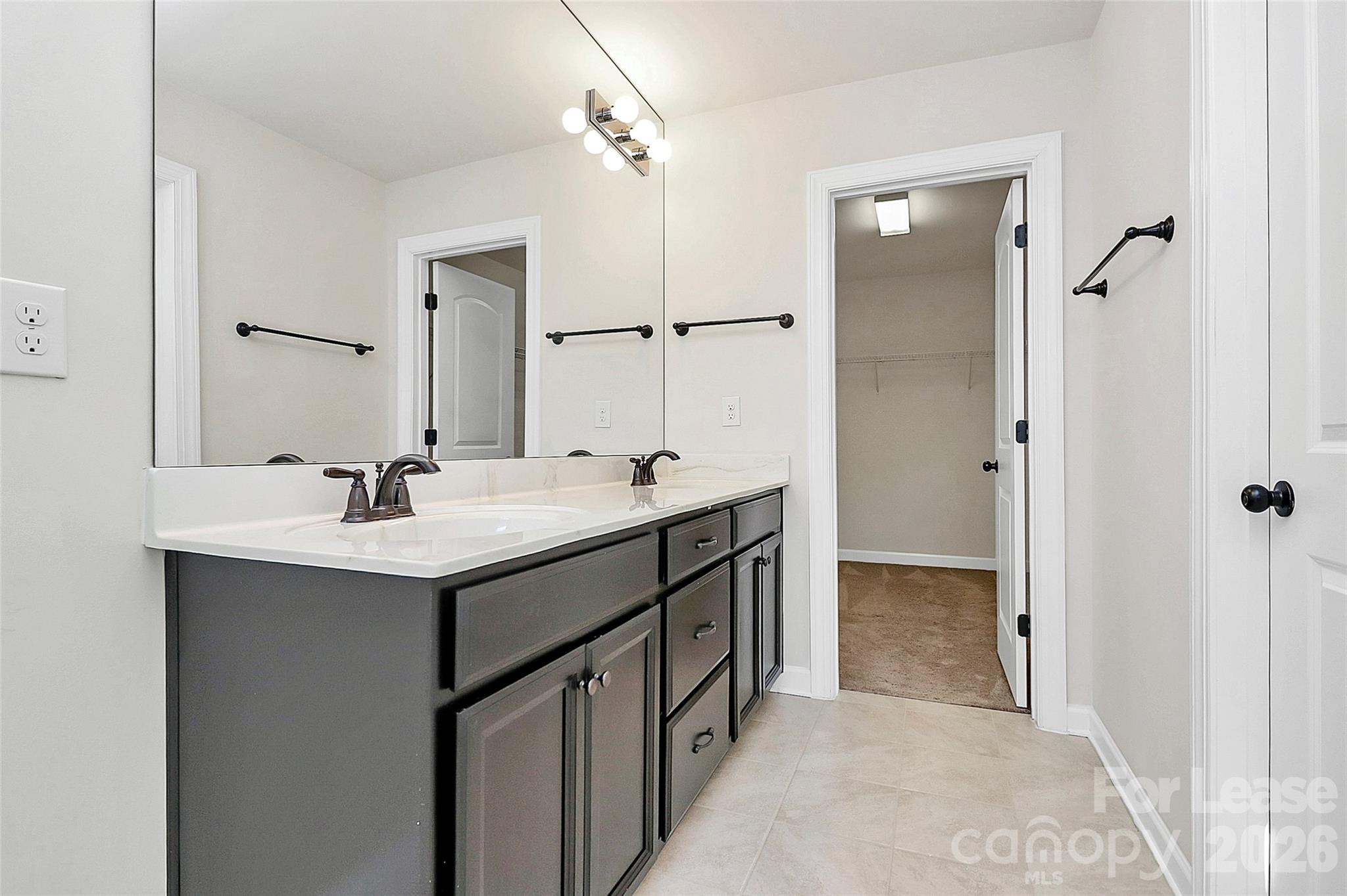 5688 Garrow Glen Road Charlotte, NC 28278 - Photo 11 of 17 a bathroom with a double vanity sink mirror and shower
