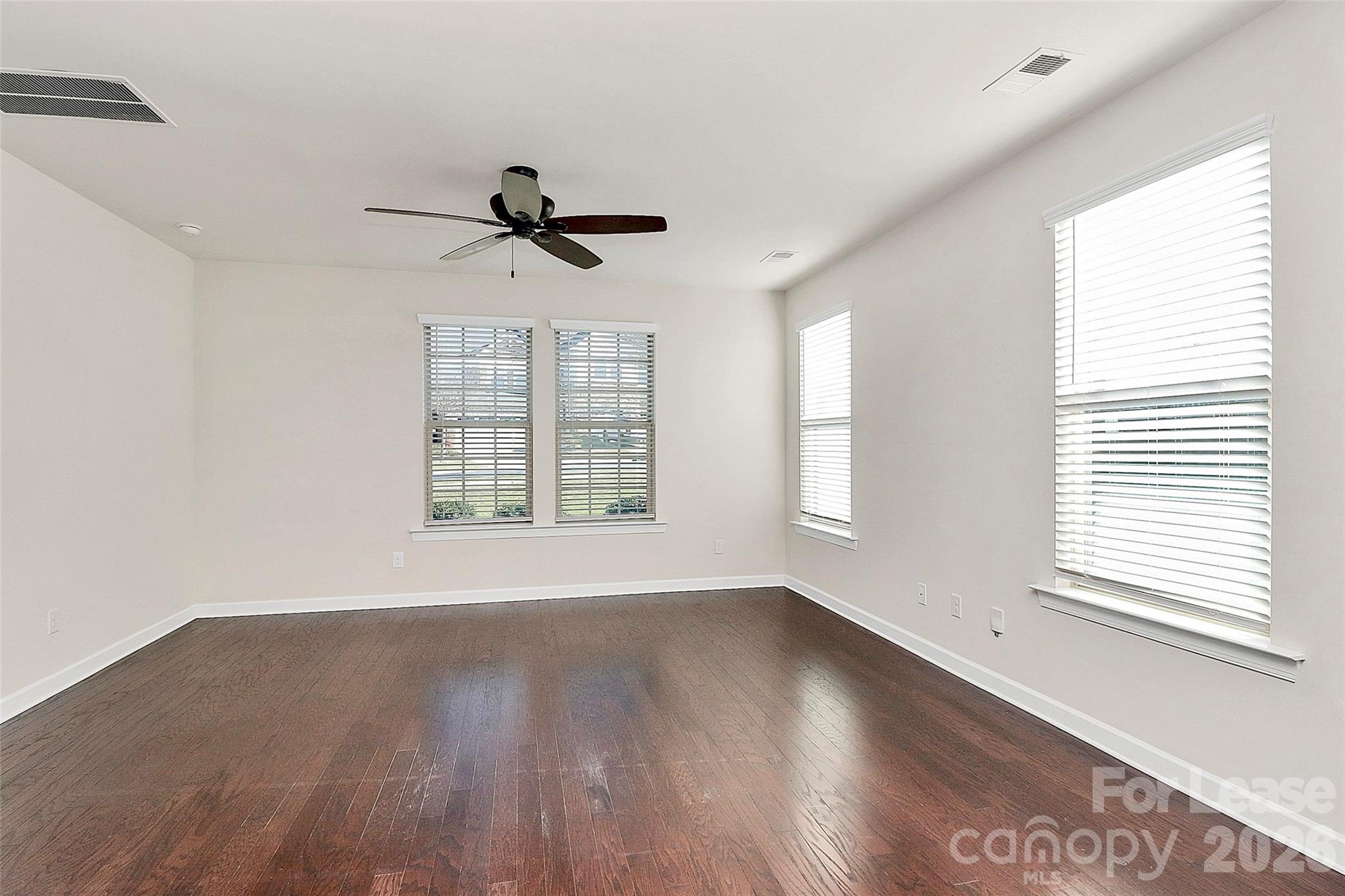5688 Garrow Glen Road Charlotte, NC 28278 - Photo 5 of 17 a view of a room with wooden floor and windows