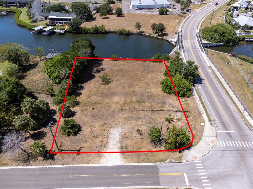 601 Flamingo Drive Apollo Beach, FL 33572 - Photo 1 of 15 an aerial view of a house with a yard and lake view
