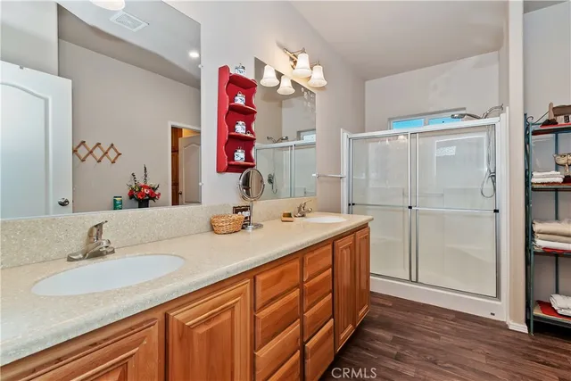 a bathroom with a sink vanity and a mirror
