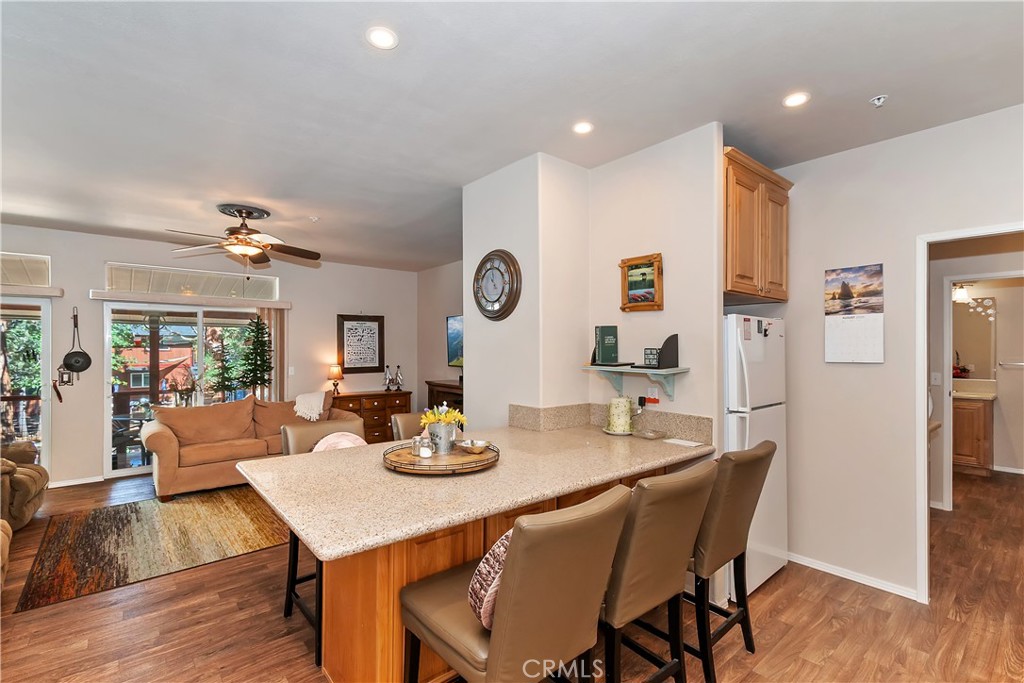 775 Riverside Avenue Sugarloaf, CA 92386 - Photo 23 of 32 a view of a dining room with furniture and wooden floor