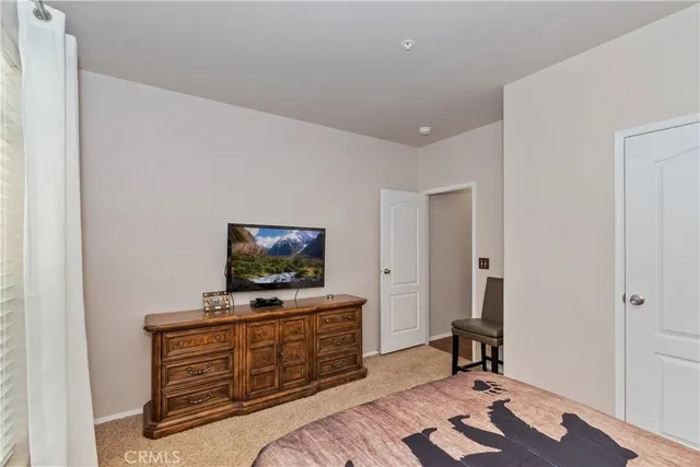 a living room with furniture and flat screen tv