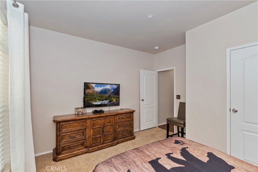 775 Riverside Avenue Sugarloaf, CA 92386 - Photo 29 of 32 a living room with furniture and flat screen tv