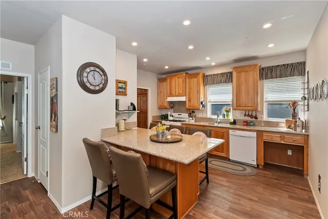 a kitchen with a dining table and chairs