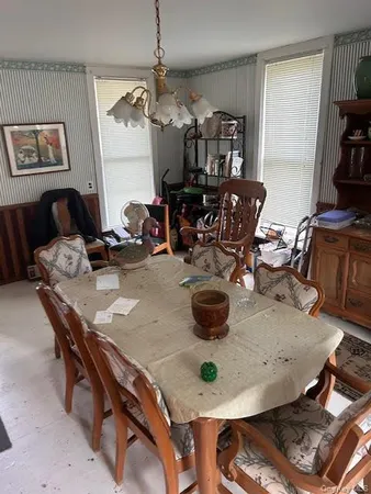 a dining room with furniture and chandelier