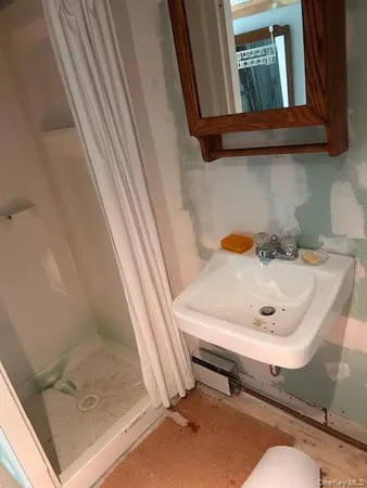 a bathroom with a sink and mirror