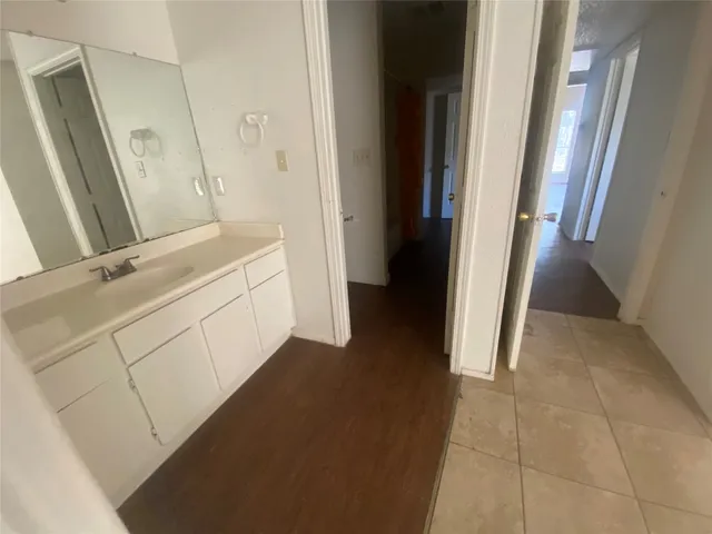 a bathroom with a sink a toilet and a shower