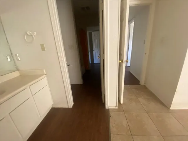 a view of a kitchen from the hallway