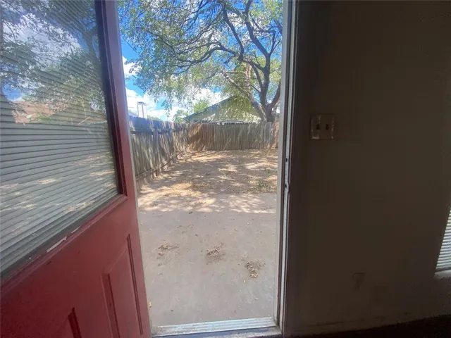 a view of a yard from a balcony