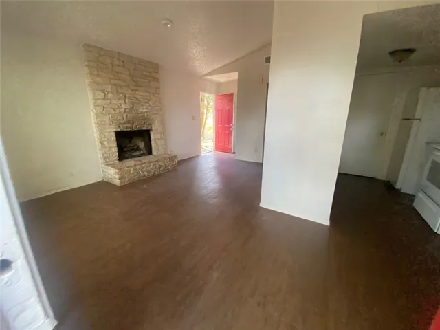 a view of empty room with floor to ceiling window