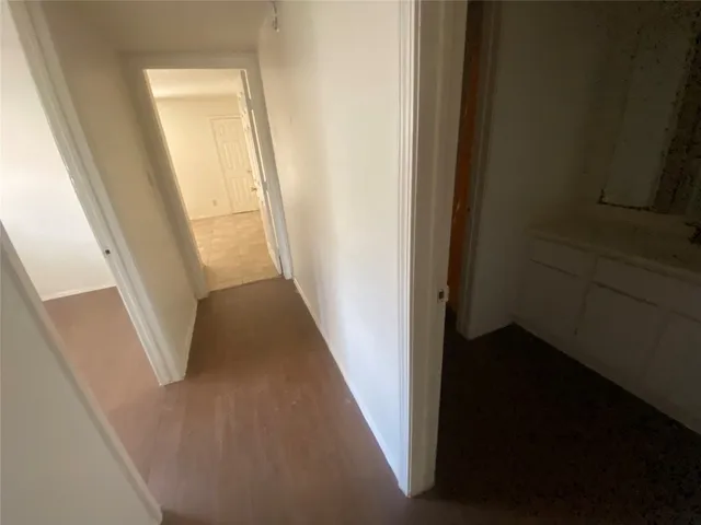 a view of a hallway with windows