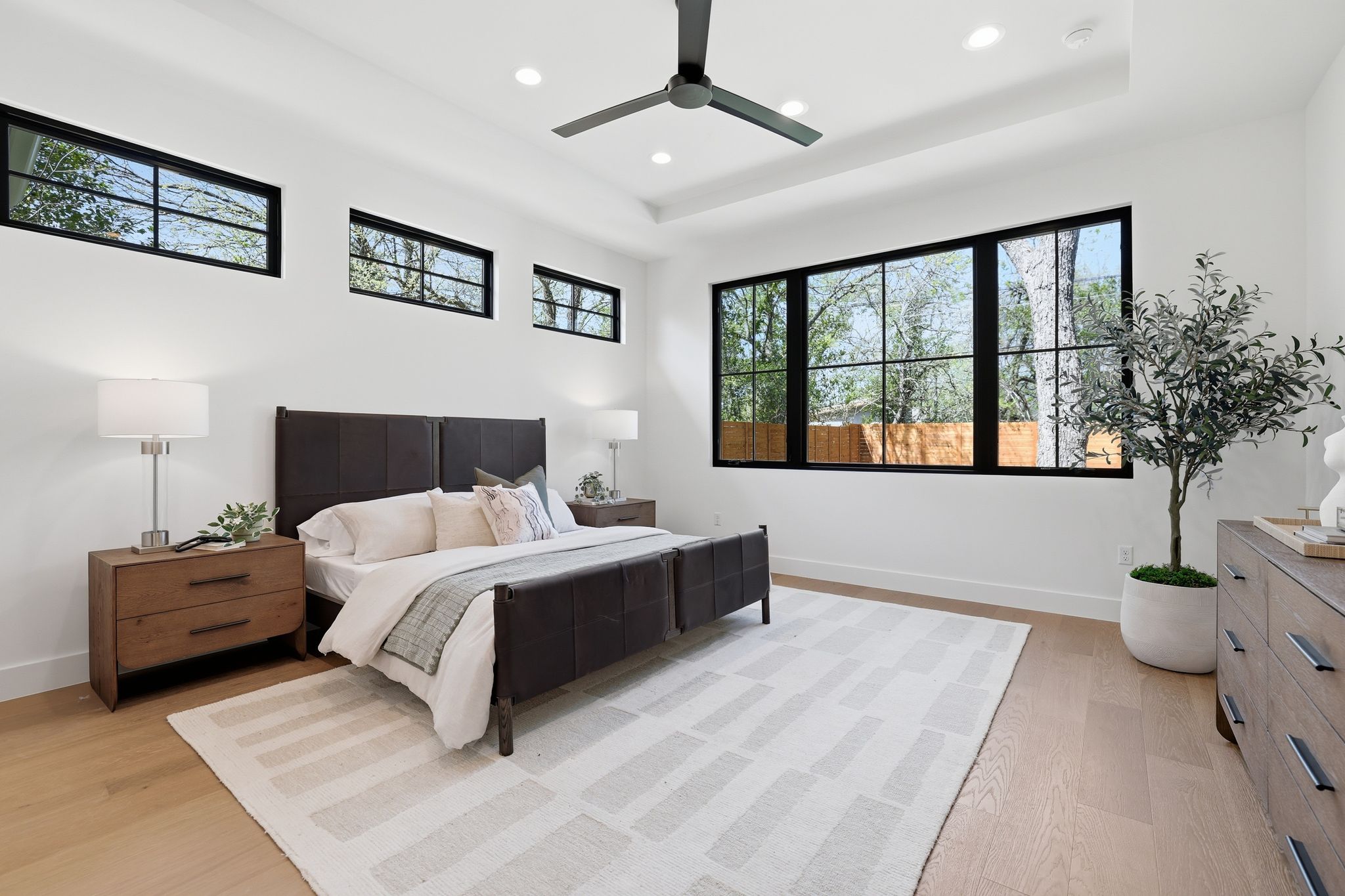 4500 Jinx Avenue Austin, TX 78745 - Photo 22 of 40 Bedroom featuring a raised ceiling, ceiling fan, recessed lighting, and light wood finished floors