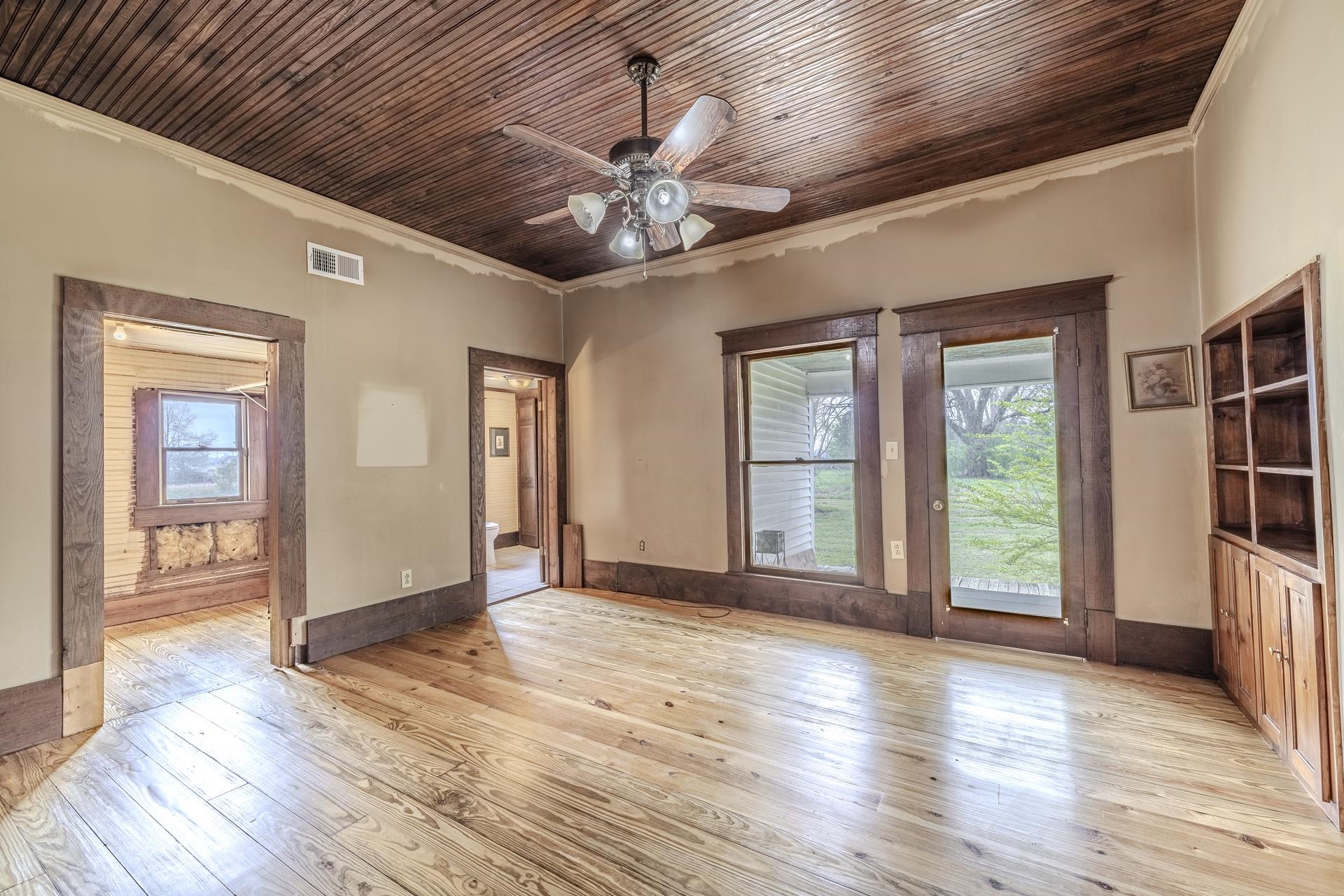 2055 Kendrick Road Michie, TN 38357 - Photo 22 of 37 a view of an empty room with wooden floor and a window