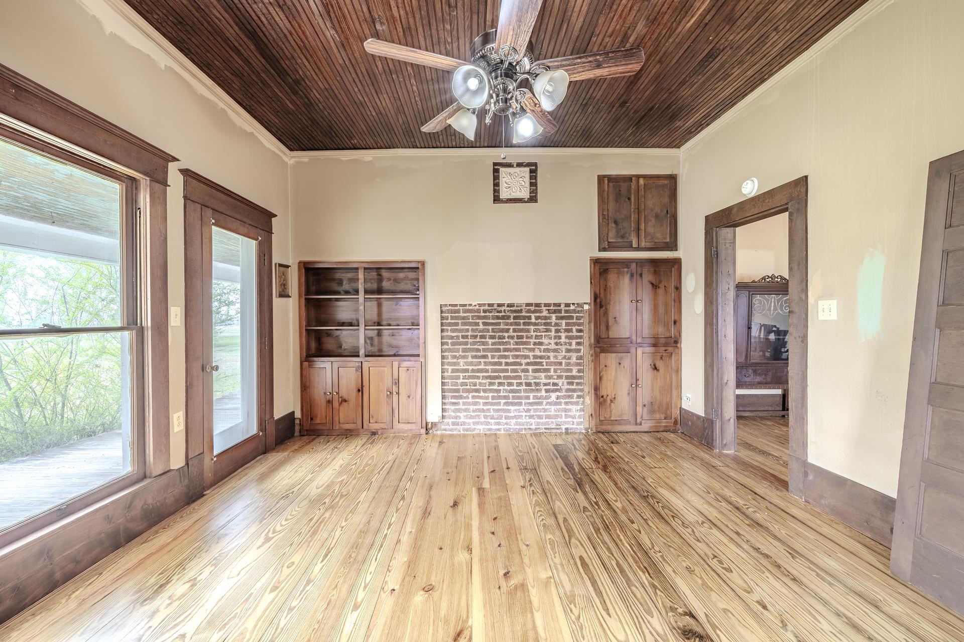 2055 Kendrick Road Michie, TN 38357 - Photo 23 of 37 a view of empty room with wooden floor and fan