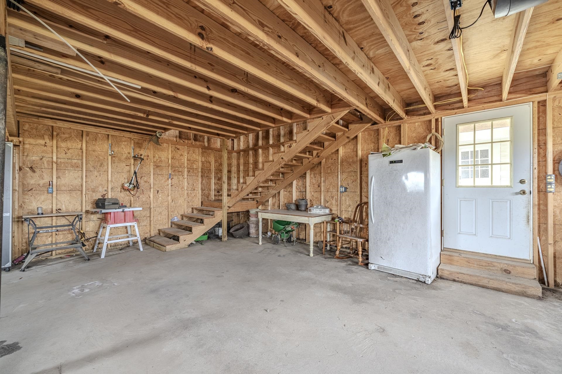 2055 Kendrick Road Michie, TN 38357 - Photo 29 of 37 an empty room with wooden floor and furniture