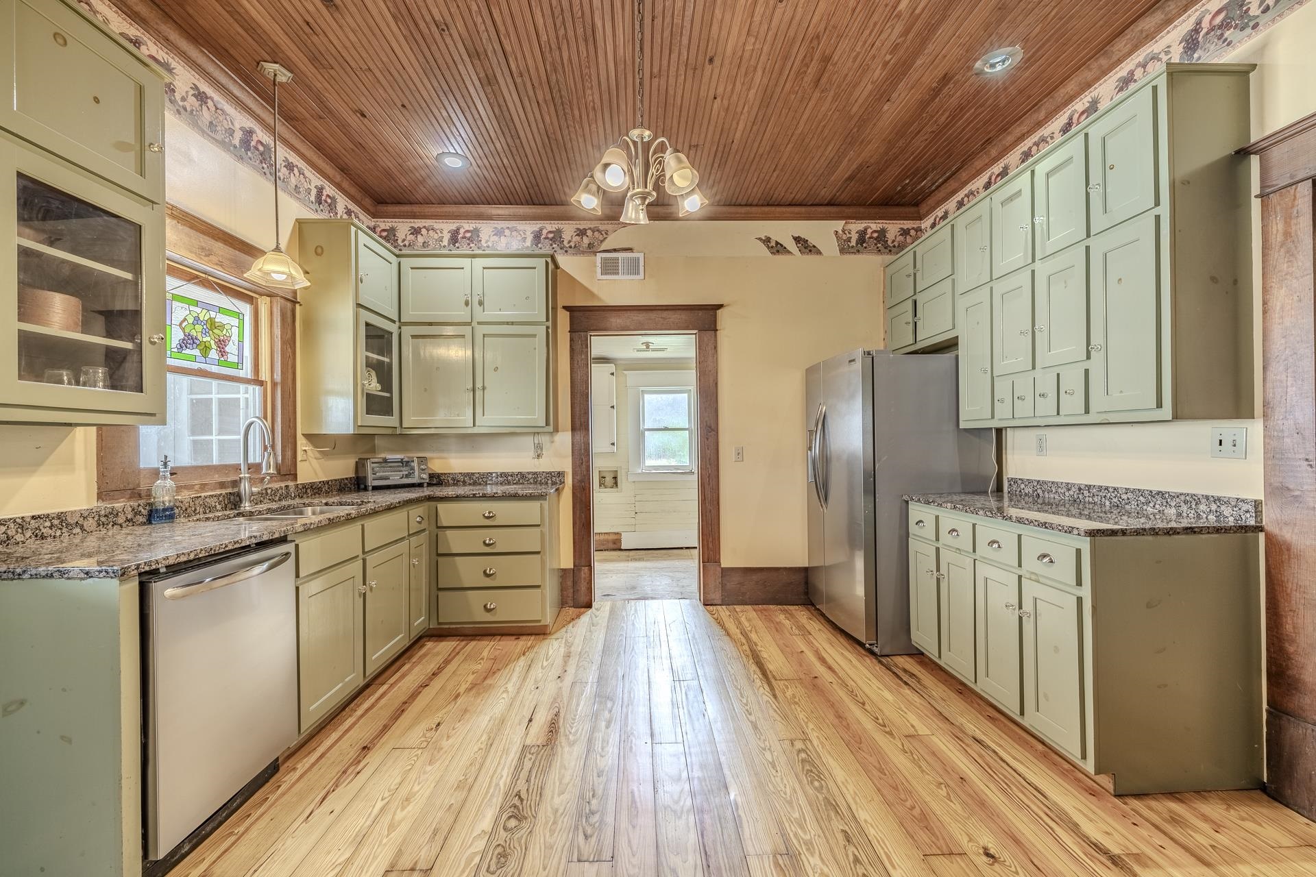 2055 Kendrick Road Michie, TN 38357 - Photo 7 of 37 a large kitchen with stainless steel appliances granite countertop a lot of counter space and wooden floors