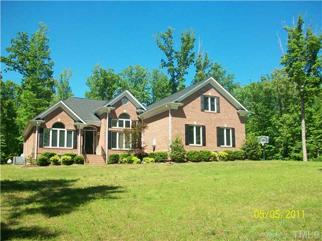 1010 Redleaf Lane Rougemont, NC 27572 - Photo 1 of 11 a front view of a house with a yard and green space