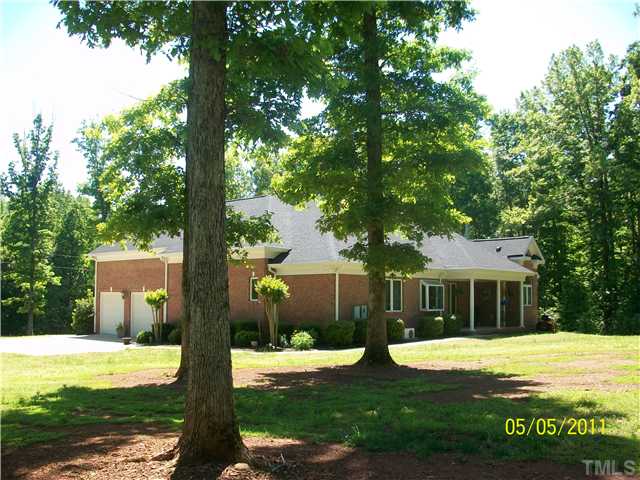 1010 Redleaf Lane Rougemont, NC 27572 - Photo 11 of 11 a view of a house with backyard and a tree