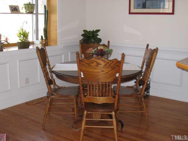 1010 Redleaf Lane Rougemont, NC 27572 - Photo 4 of 11 a view of a dining room with furniture and wooden floor