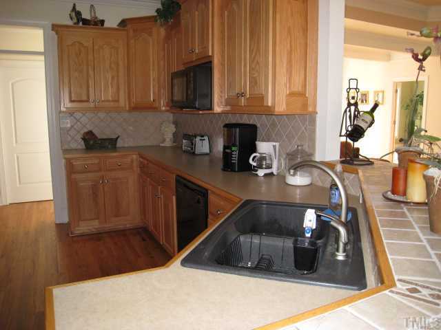 1010 Redleaf Lane Rougemont, NC 27572 - Photo 6 of 11 a kitchen with a sink and cabinets