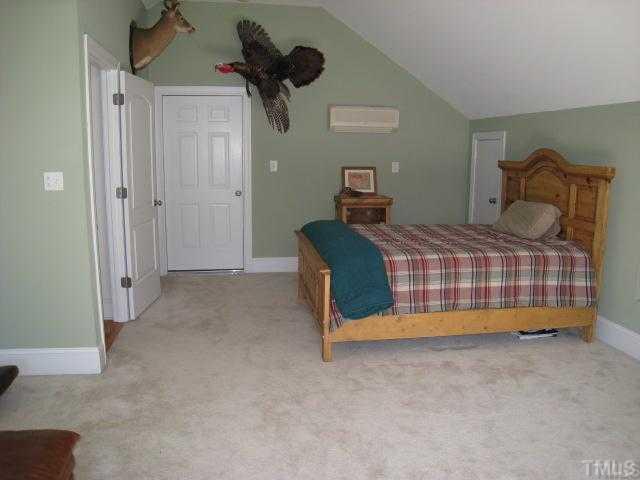 1010 Redleaf Lane Rougemont, NC 27572 - Photo 9 of 11 a bedroom with a bed and a painting on the wall