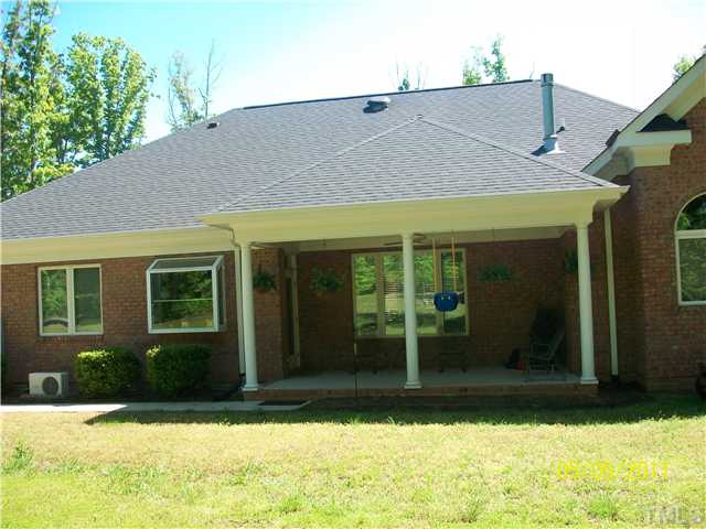1010 Redleaf Lane Rougemont, NC 27572 - Photo 10 of 11 a front view of a house with garden