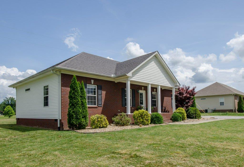 962 Mt Vernon Road Bethpage, TN 37022 - Photo 19 of 23 a front view of a house with a yard and garage