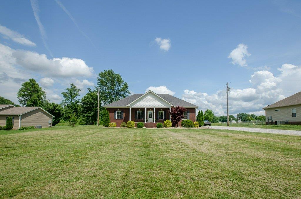 962 Mt Vernon Road Bethpage, TN 37022 - Photo 23 of 23 a white house with a big yard and large trees