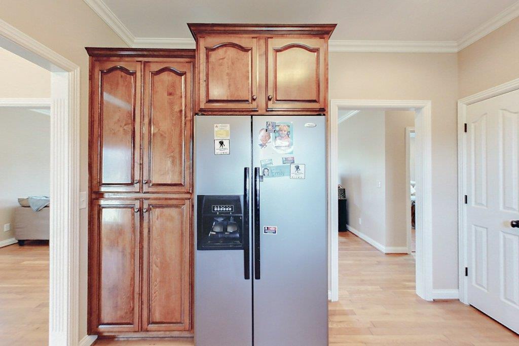 962 Mt Vernon Road Bethpage, TN 37022 - Photo 8 of 23 a view of hallway with granite countertop a refrigerator and a stove