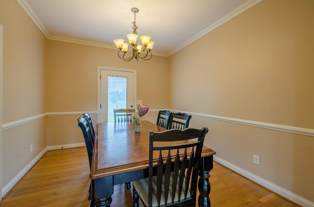 962 Mt Vernon Road Bethpage, TN 37022 - Photo 9 of 23 a view of a dining room with furniture and chandelier