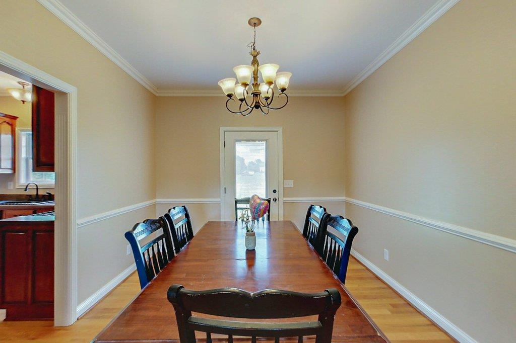 962 Mt Vernon Road Bethpage, TN 37022 - Photo 10 of 23 a view of a dining room with furniture and chandelier