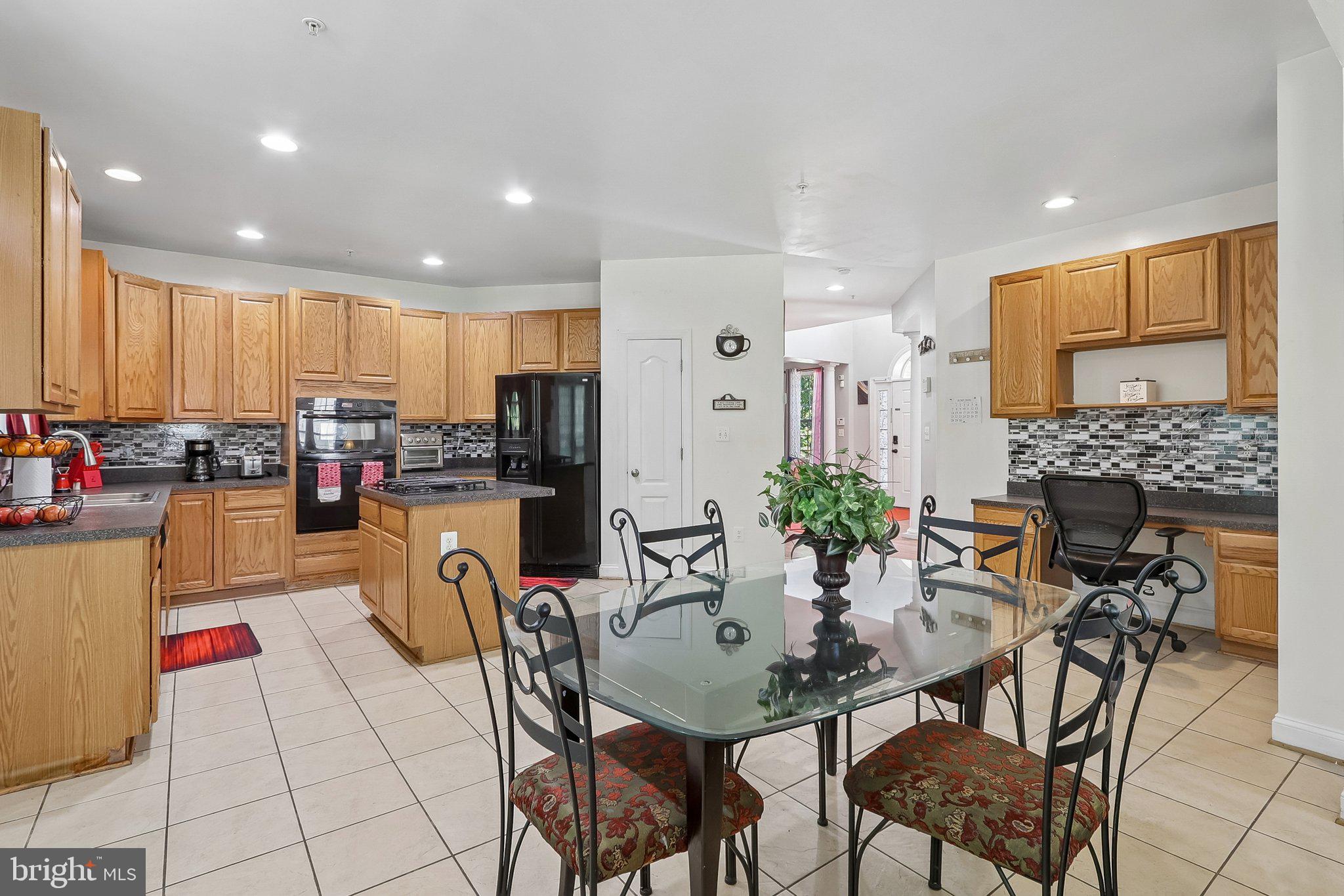 9003 Eldon Drive Clinton, MD 20735 - Photo 9 of 54 Modern kitchen with elegant finishes.