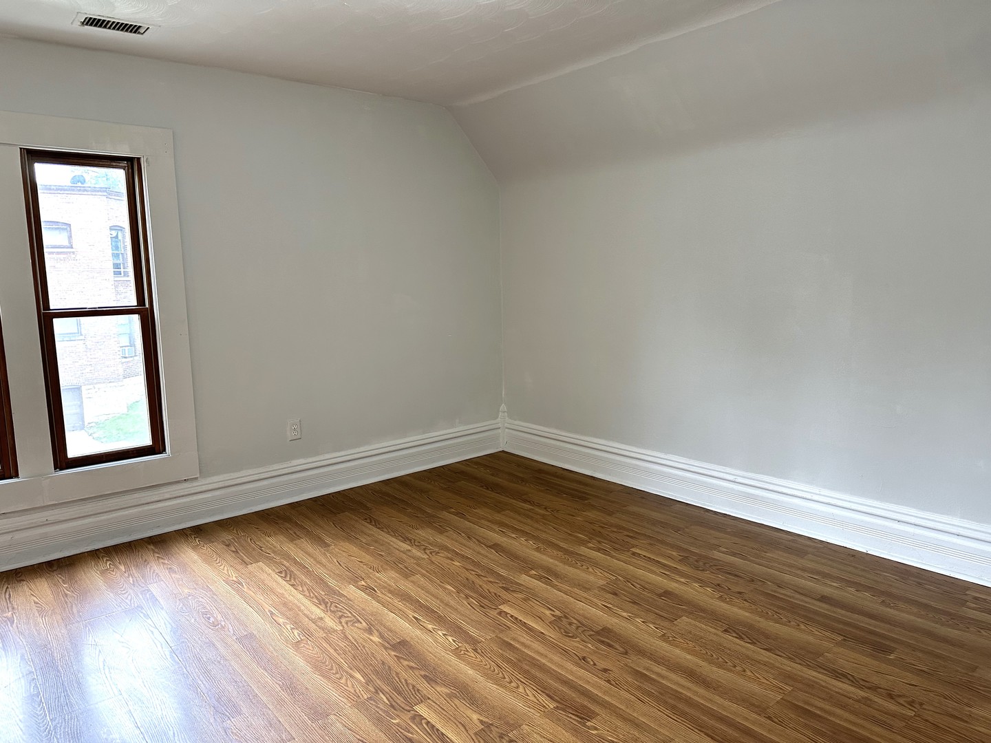 318 North Street Elgin, IL 60120 - Photo 5 of 5 a view of an empty room with wooden floor and a window