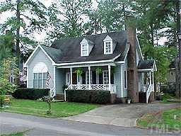 3220 Flintshire Road Raleigh, NC 27604 - Photo 1 of 1 a front view of a house with a garden and plants