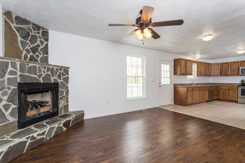 5261 Saunders Road Vinton, VA 24179 - Photo 8 of 47 a view of a livingroom with a fireplace and window