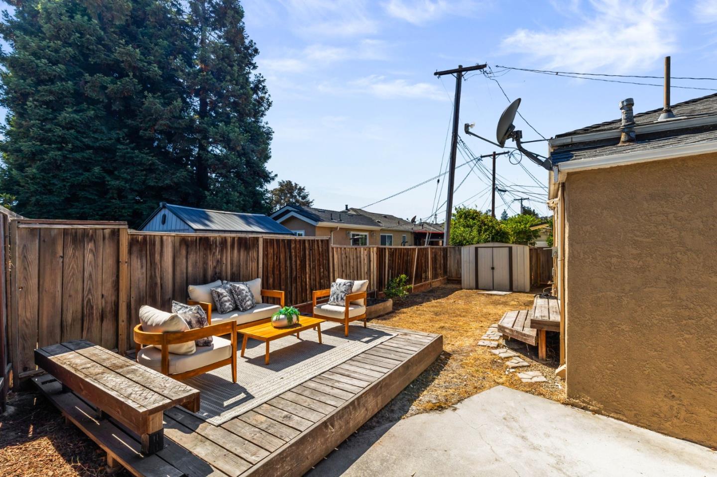 20860 Baker Road Castro Valley, CA 94546 - Photo 17 of 21 a view of a roof deck with couches chairs and wooden fence