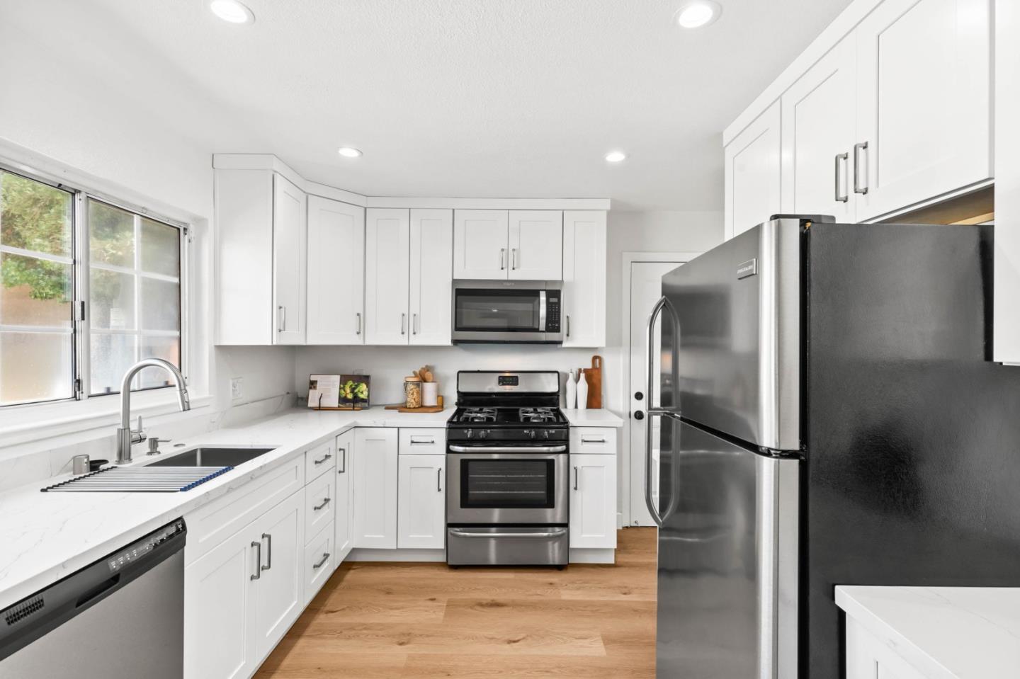 20860 Baker Road Castro Valley, CA 94546 - Photo 7 of 21 a kitchen with a refrigerator sink and stove