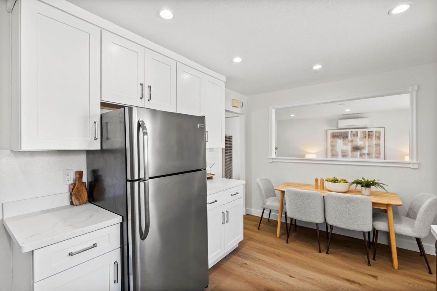 20860 Baker Road Castro Valley, CA 94546 - Photo 10 of 21 a kitchen with stainless steel appliances refrigerator stove and wooden floor