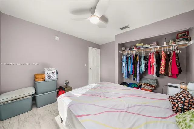 a bed room with a bed and a walk in closet