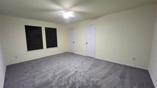 a bathroom with a toilet a sink and a shower