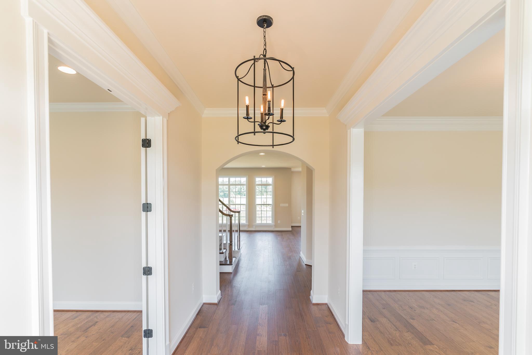 Red Oak Road Cross Junction, VA 22625 - Photo 11 of 11 a view of a hallway with wooden floor and chandelier