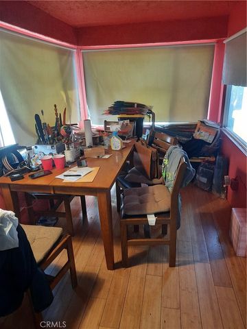 a kitchen with lots of bottles of alcohol
