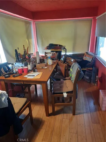 a kitchen with lots of bottles of alcohol
