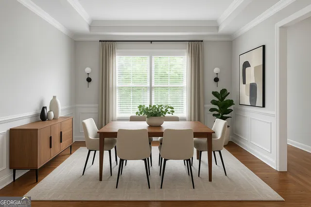 a view of a dining room with furniture window and wooden floor